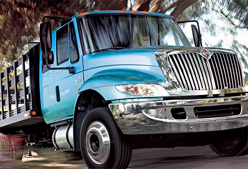 Commercial Auto Insurance vehicle, like a delivery van on the road.